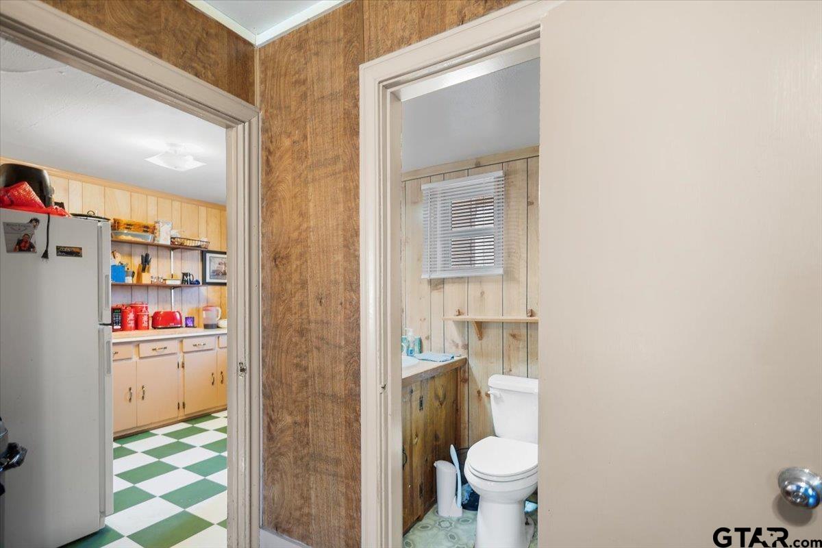 1706 Baxter Avenue Longview, TX 75602 - Photo 8 of 32 a bathroom with a toilet and a sink