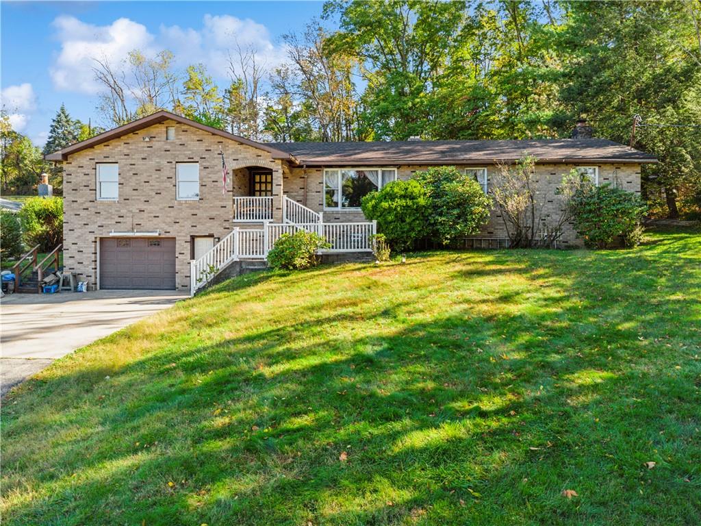361 Maple Road Pittsburgh, PA 15239 - Photo 1 of 38 a front view of a house with a yard