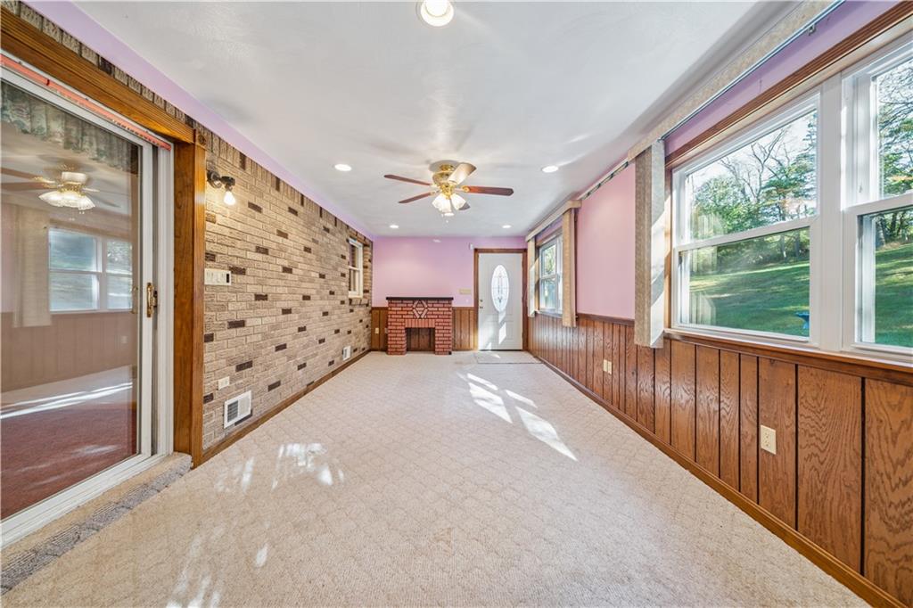 361 Maple Road Pittsburgh, PA 15239 - Photo 16 of 38 a view of entryway with chandelier and wooden floor