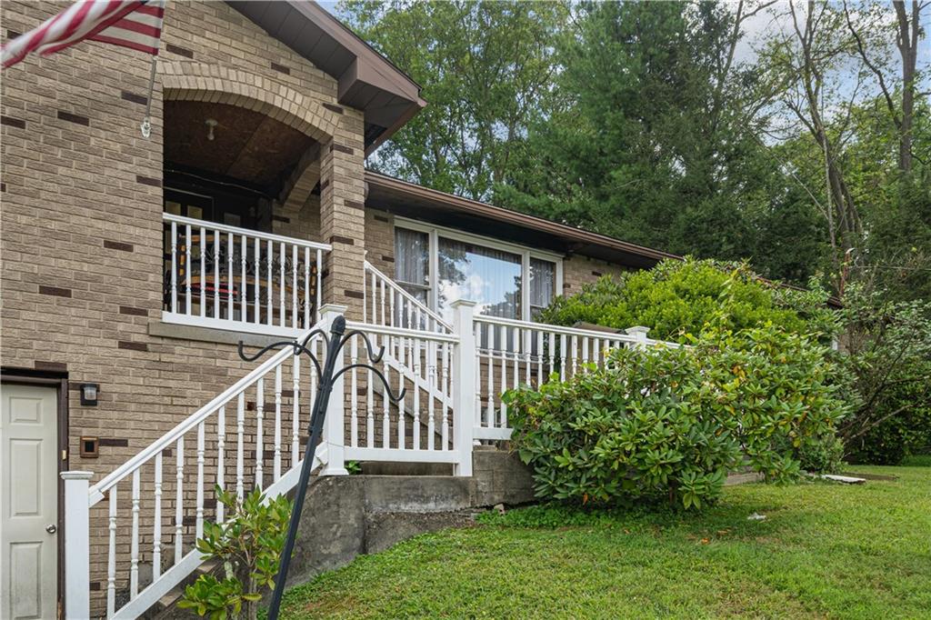 361 Maple Road Pittsburgh, PA 15239 - Photo 37 of 38 a view of a house with a small yard and deck