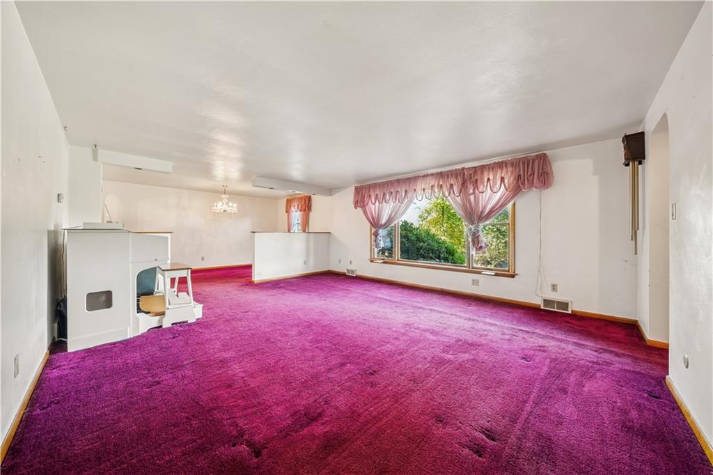 361 Maple Road Pittsburgh, PA 15239 - Photo 5 of 38 a view of empty room with wooden floor and fan