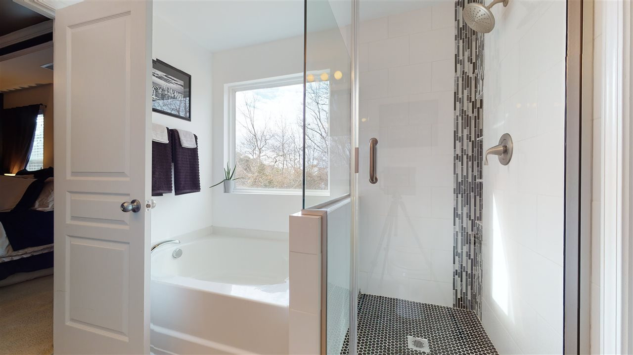 3612 Althorp Drive Raleigh, NC 27616 - Photo 17 of 30 Updated master bathroom with floor to ceiling tile in glass walk-in shower and large walk-in closet. Master Bathroom