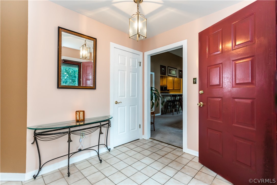 13809 Sandy Oak Road Chester, VA 23831 - Photo 5 of 37 a room that has a window and furniture
