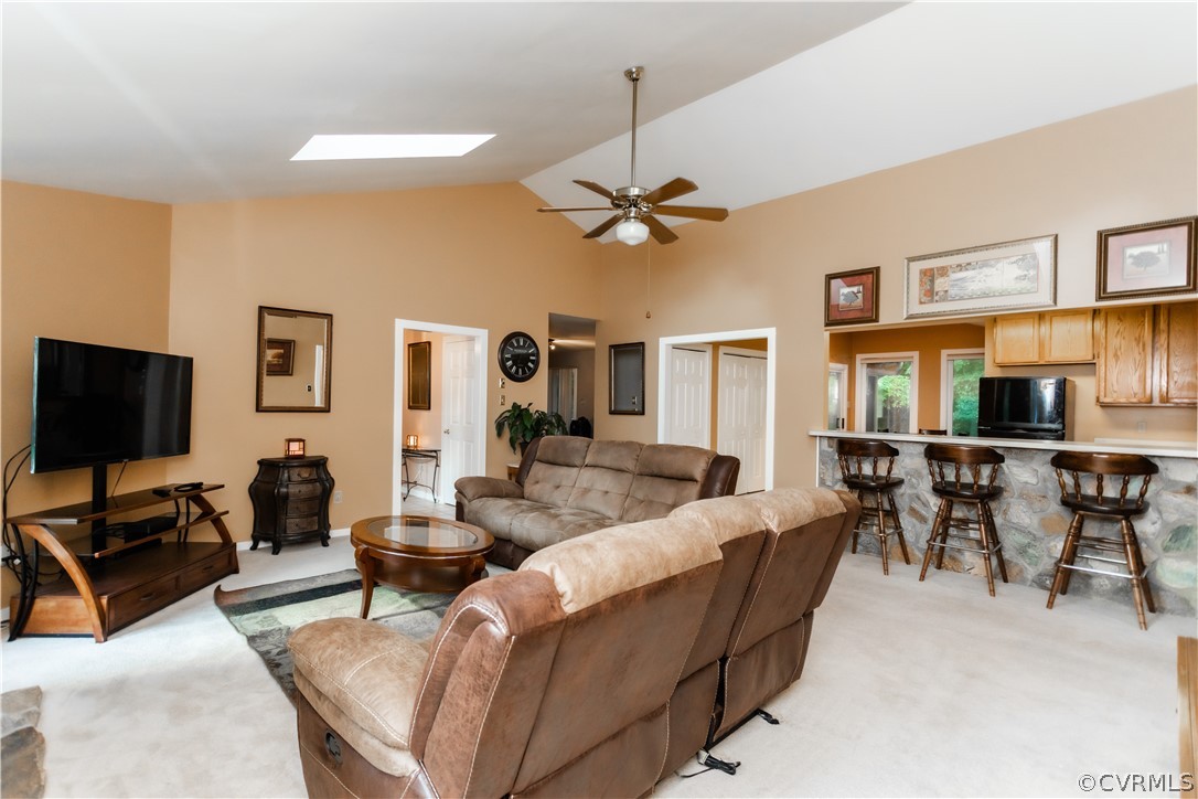 13809 Sandy Oak Road Chester, VA 23831 - Photo 6 of 37 a living room with furniture a dining table and a piano