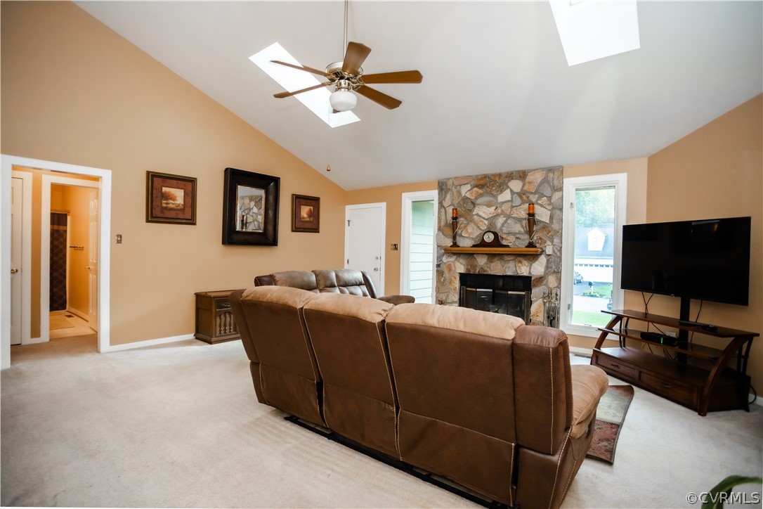 13809 Sandy Oak Road Chester, VA 23831 - Photo 10 of 37 a living room with furniture a flat screen tv and a fireplace