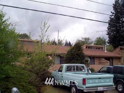 6108 Rockefeller Avenue Everett, WA 98203 - Photo 1 of 1 a front view of a house with a yard