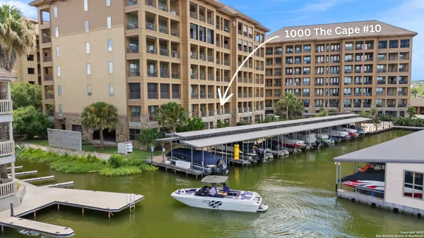 a view of swimming pool with outdoor seating