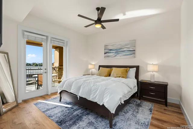 a bedroom with a bed bookshelf and a window