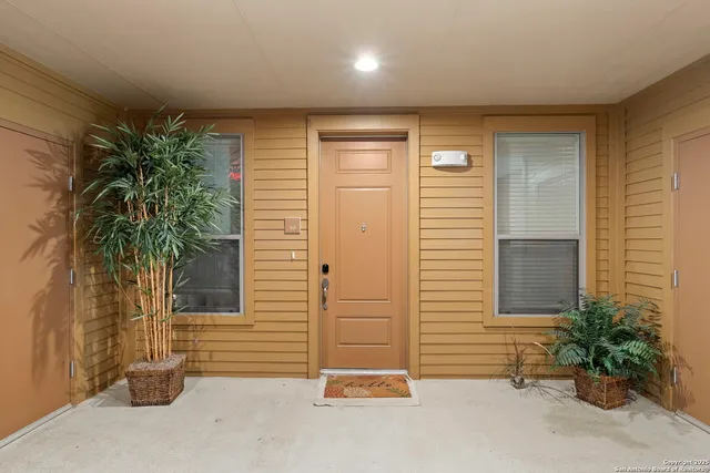 a view of living room with furniture and floor to ceiling window