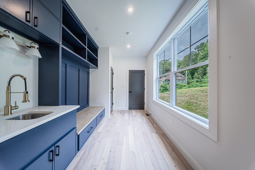 2 Spring Meadow Drive Southborough, MA 01772 - Photo 16 of 42 a spacious bathroom with a double vanity sink and a large mirror