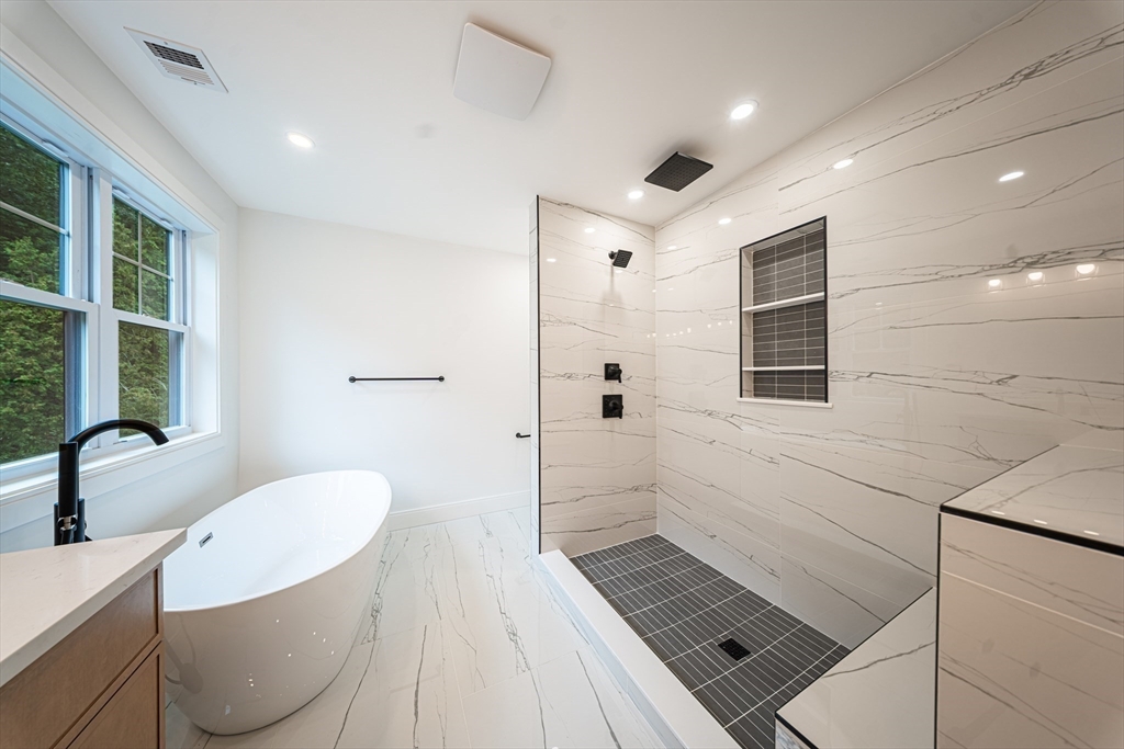 2 Spring Meadow Drive Southborough, MA 01772 - Photo 23 of 42 a bathroom with a sink toilet and shower