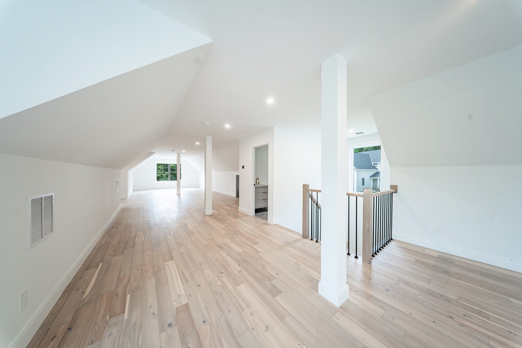 2 Spring Meadow Drive Southborough, MA 01772 - Photo 36 of 42 a view of a hallway with wooden floor