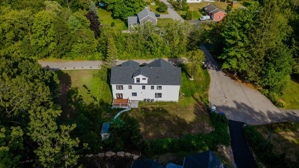 2 Spring Meadow Drive Southborough, MA 01772 - Photo 42 of 42 an aerial view of a house with a yard and garden