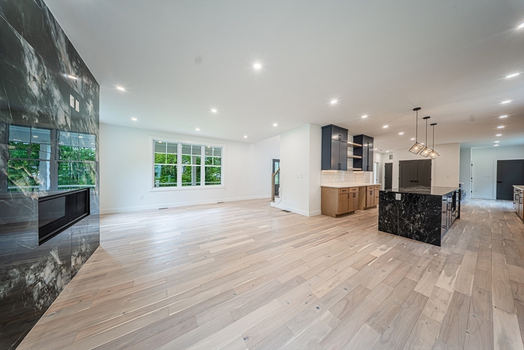 2 Spring Meadow Drive Southborough, MA 01772 - Photo 10 of 42 a large kitchen with stainless steel appliances kitchen island granite countertop a large window a oven and a sink