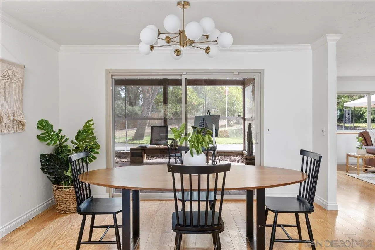 1786 Lorry Lane Escondido, CA 92029 - Photo 18 of 39 a view of a dining room with furniture window and wooden floor