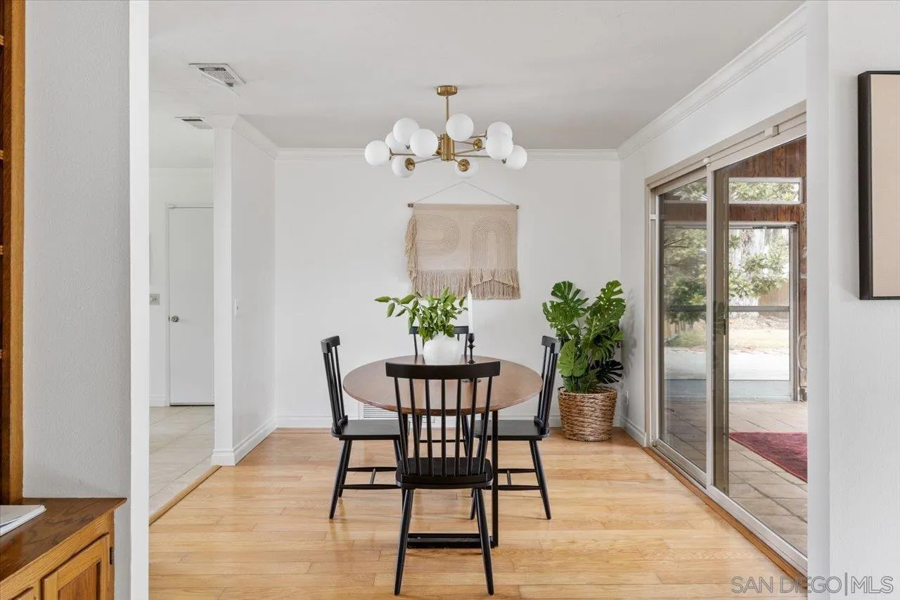 1786 Lorry Lane Escondido, CA 92029 - Photo 19 of 39 a view of a dining room with furniture window and wooden floor