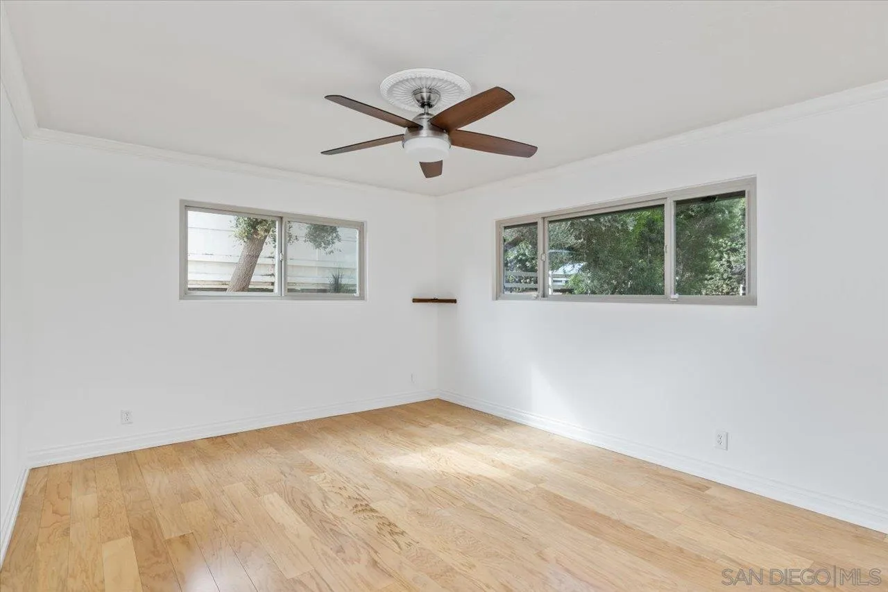 1786 Lorry Lane Escondido, CA 92029 - Photo 31 of 39 a view of empty room with wooden floor and fan