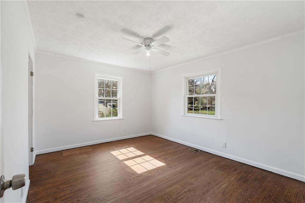 173 Winndale Road Dallas, GA 30157 - Photo 10 of 23 a view of empty room with wooden floor and fan