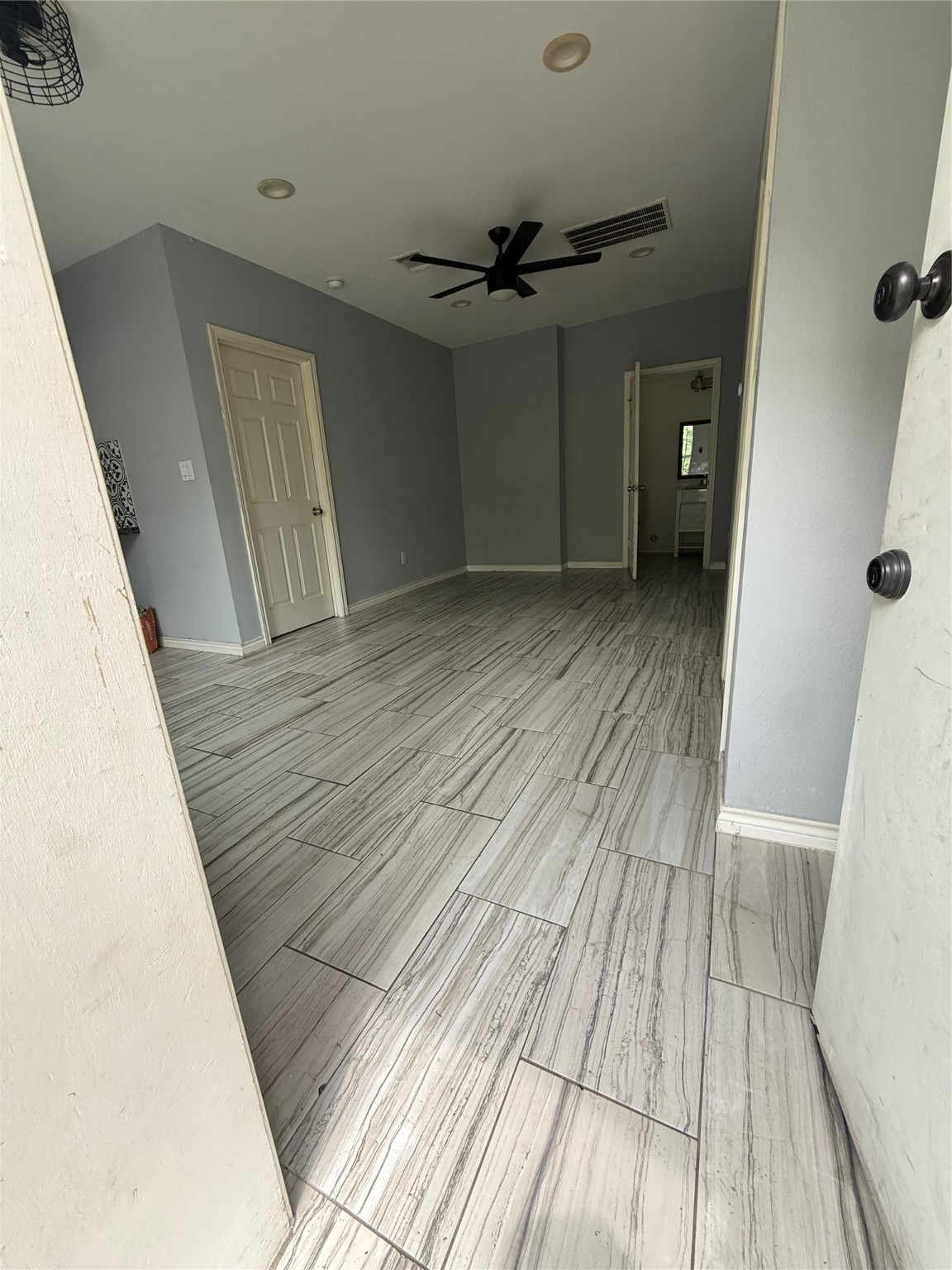4707 Mallow Street, Unit B Houston, TX 77033 - Photo 14 of 16 wooden floor in an empty room with a fireplace