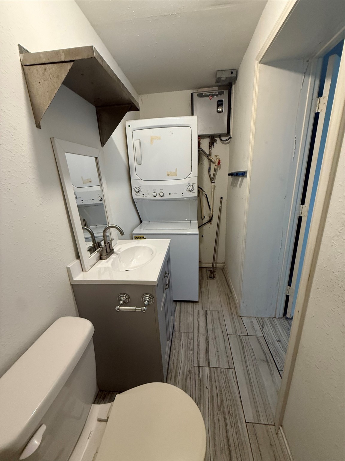 4707 Mallow Street, Unit B Houston, TX 77033 - Photo 10 of 16 a bathroom with a sink and toilet