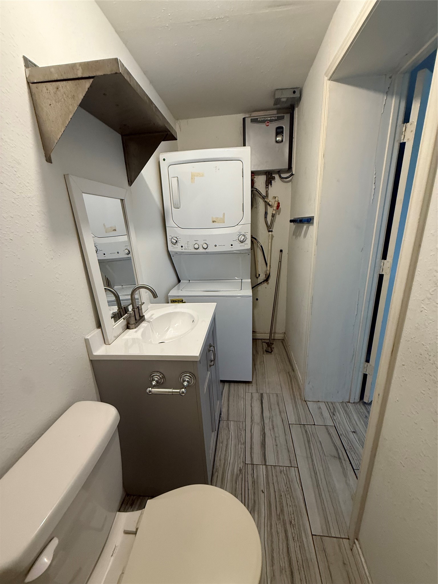 4707 Mallow Street, Unit B Houston, TX 77033 - Photo 10 of 16 a bathroom with a sink and toilet