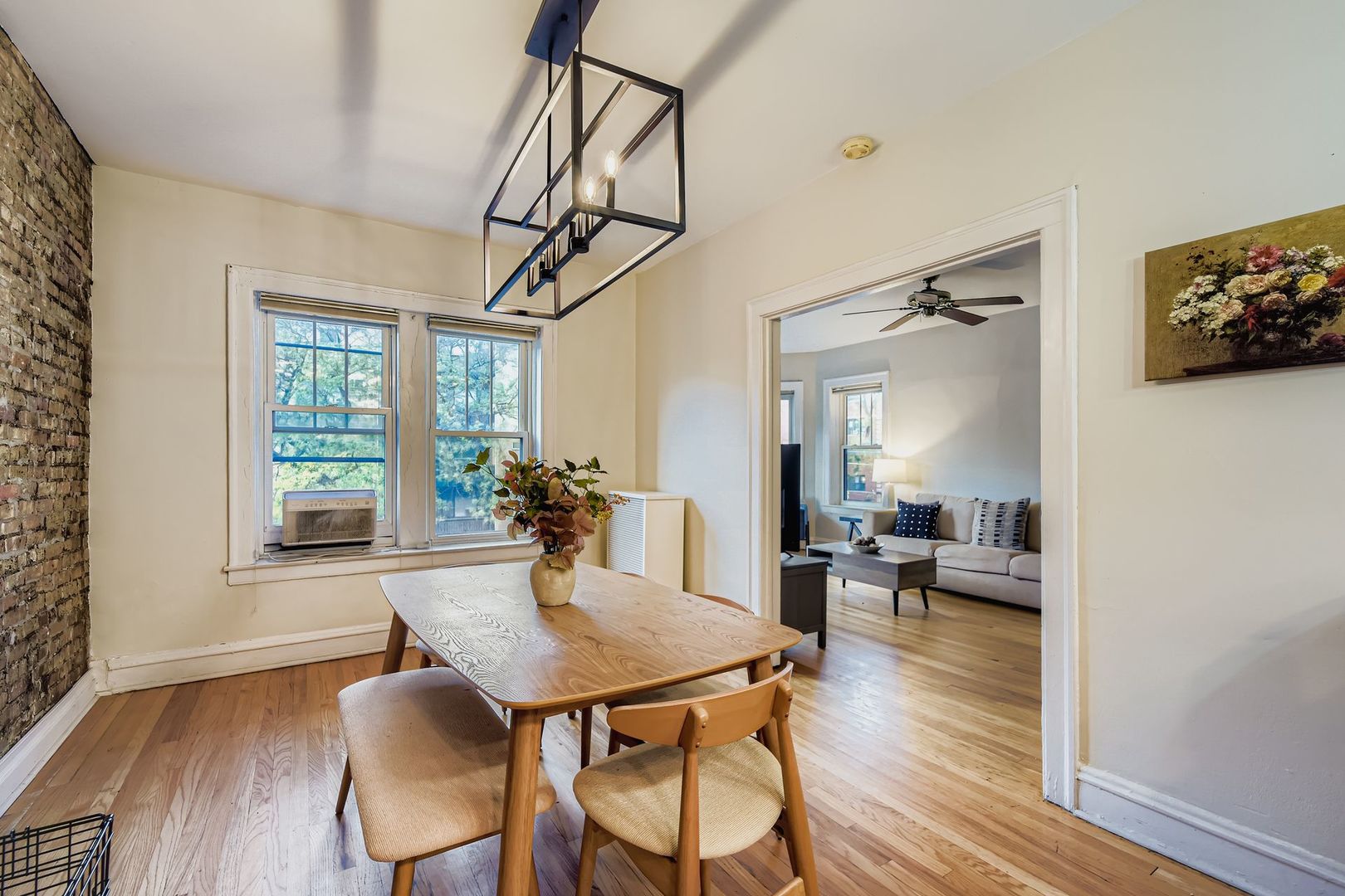 539 West Addison Street, Unit 2N Chicago, IL 60613 - Photo 11 of 23 a view of a dining room with furniture window and wooden floor