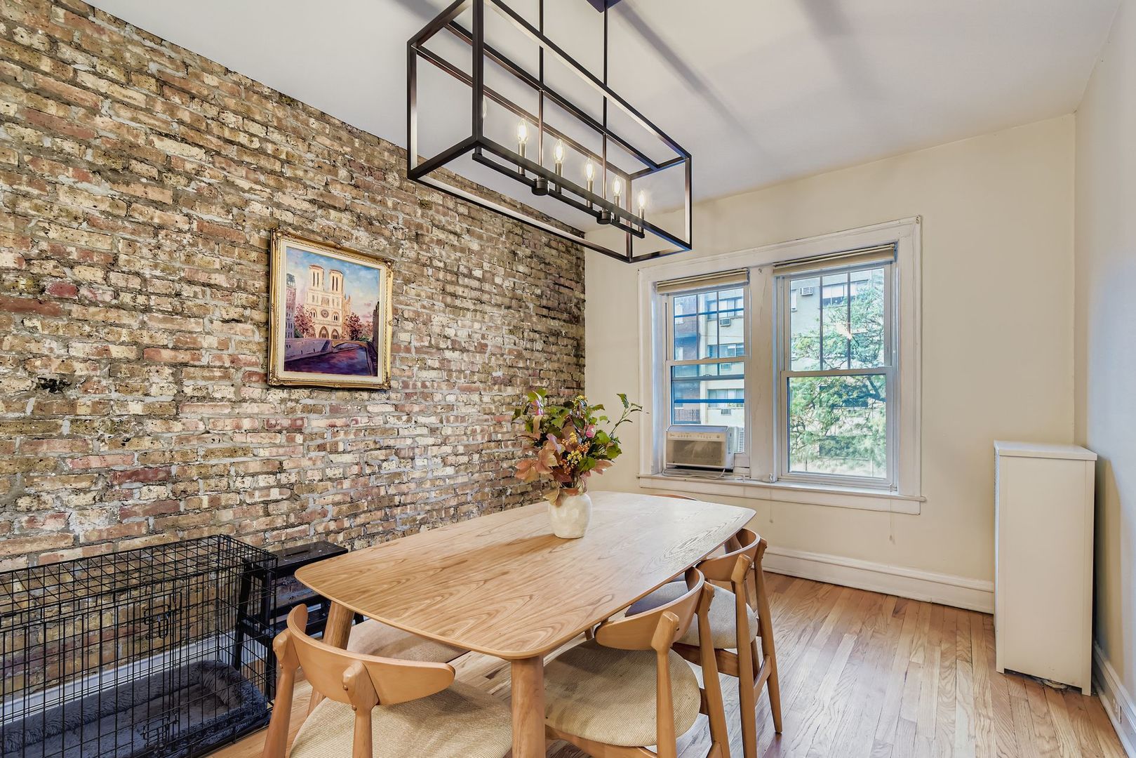539 West Addison Street, Unit 2N Chicago, IL 60613 - Photo 12 of 23 a view of a dining room with furniture window and wooden floor