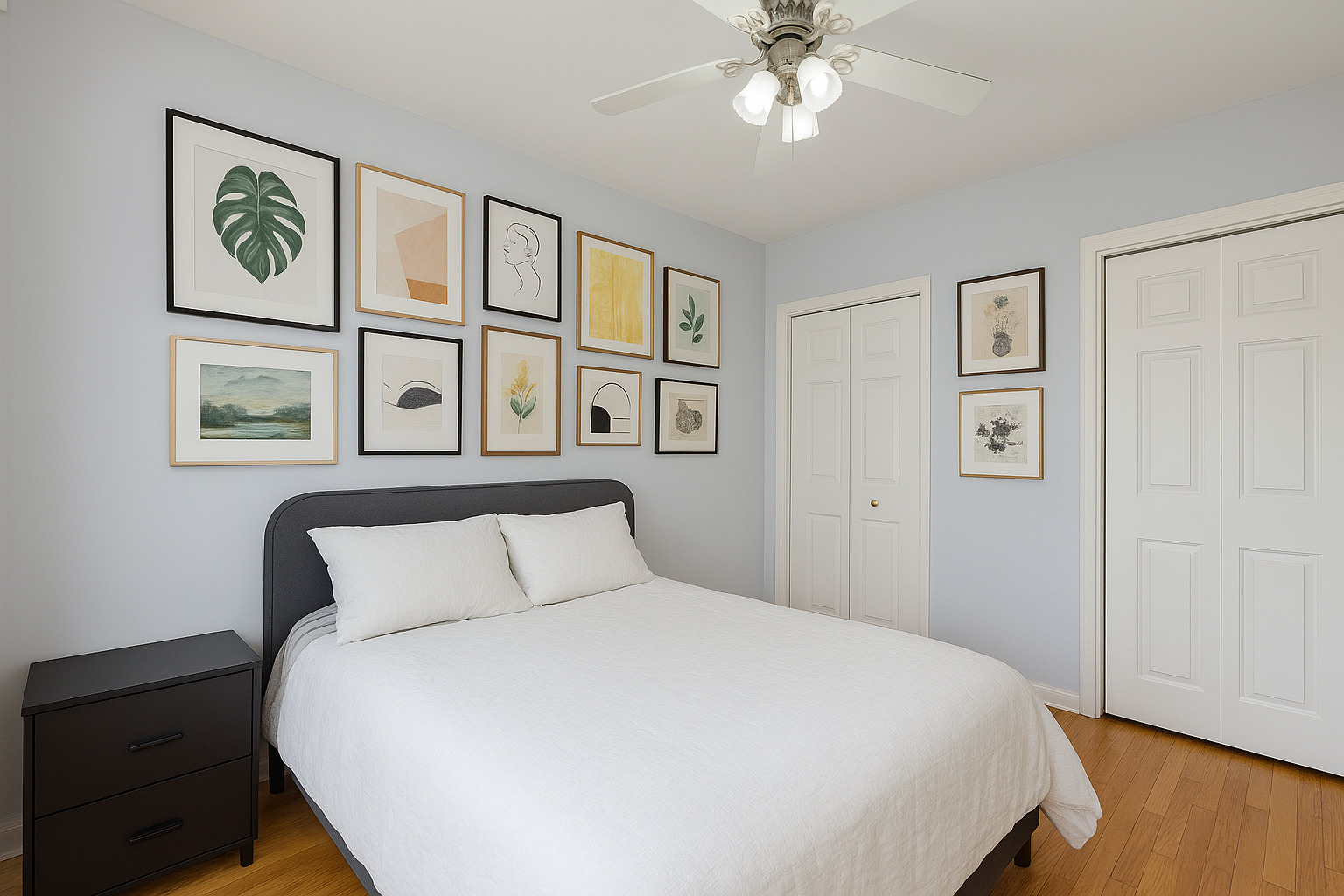 539 West Addison Street, Unit 2N Chicago, IL 60613 - Photo 21 of 23 a bedroom with a large bed and a chandelier