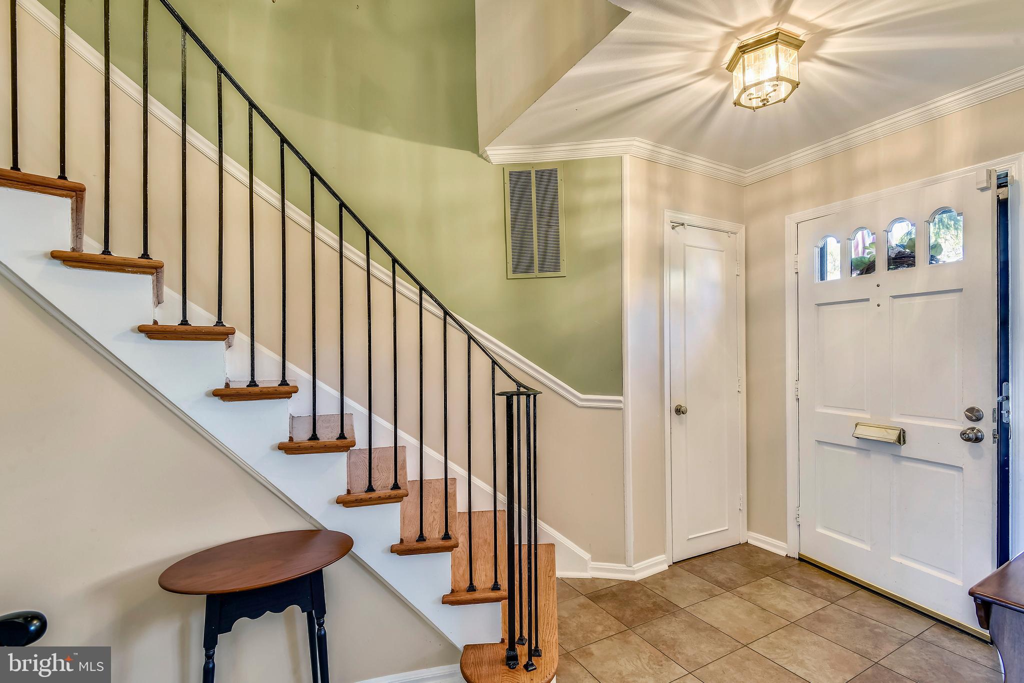 Welcoming Hall with Circular Staircase