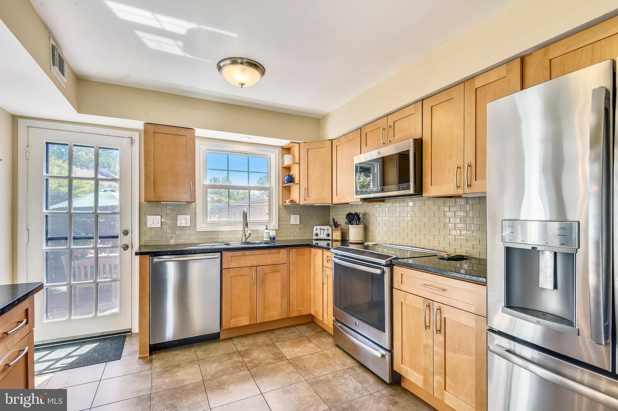 6030 Queenston Street Springfield, VA 22152 - Photo 9 of 49 Kitchen flows to Patio