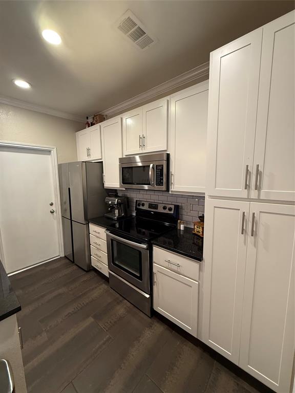 5616 Preston Oaks Road, Unit 1605 Dallas, TX 75254 - Photo 1 of 24 The beautifully updated kitchen features plenty of storage, gleaming granite counter tops and stainless steel appliances. The door leads to the one car garage and laundry area.