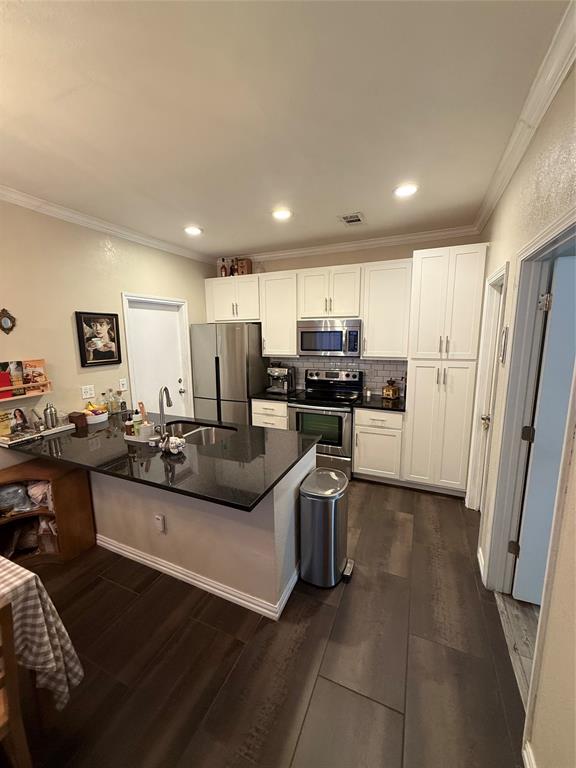 5616 Preston Oaks Road, Unit 1605 Dallas, TX 75254 - Photo 2 of 24 The kitchen features recessed lighting and a island-breakfast bar for entertaining.