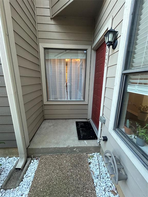 5616 Preston Oaks Road, Unit 1605 Dallas, TX 75254 - Photo 21 of 24 The courtyard entry is gated between two condo units.