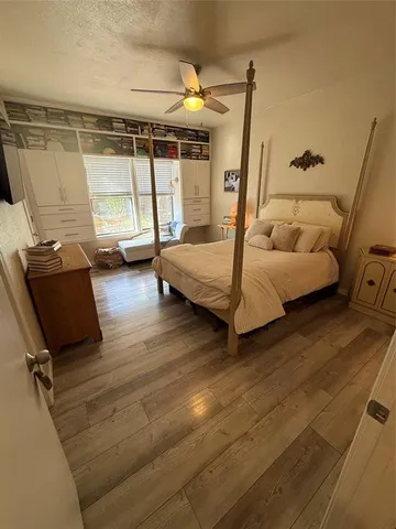 a bedroom with furniture and a window