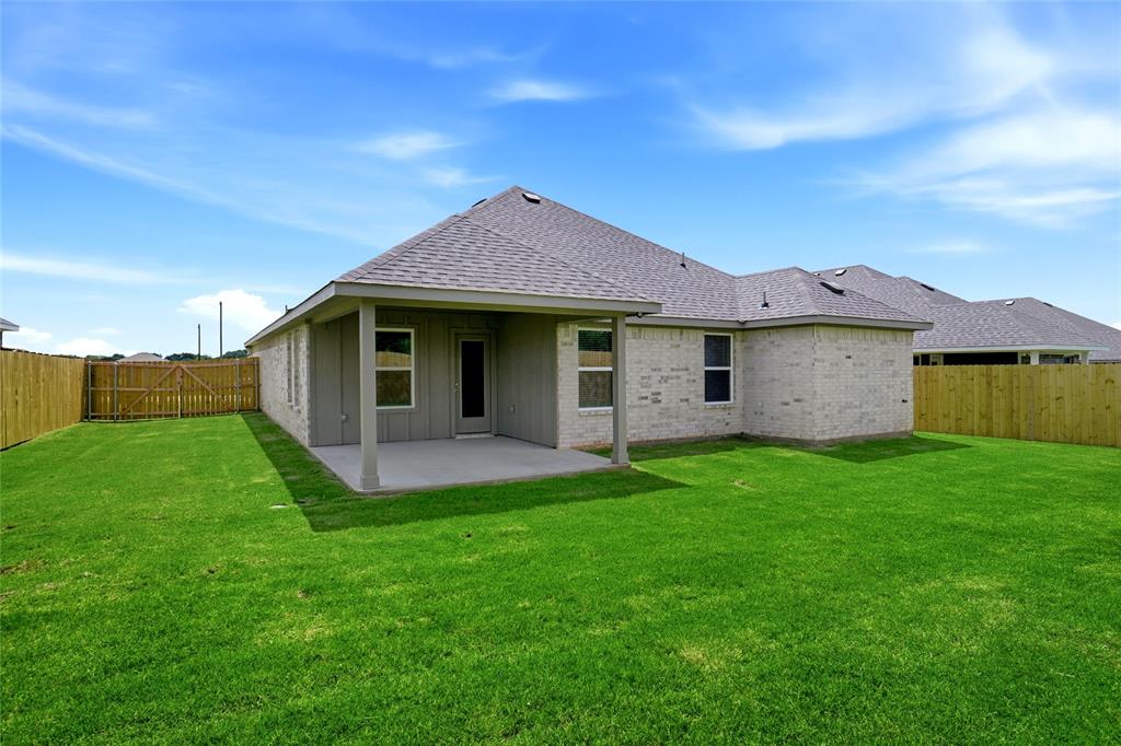 133 Joel Street Springtown, TX 76082 - Photo 15 of 15 front view of a house with a yard