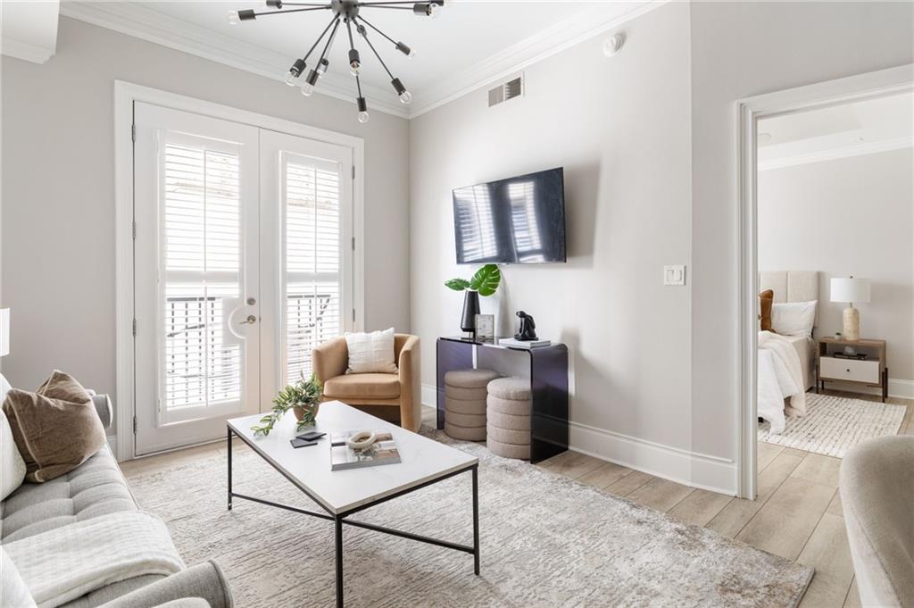 2255 Peachtree Road Northeast, Unit 326 Atlanta, GA 30309 - Photo 11 of 37 a living room with furniture and a window