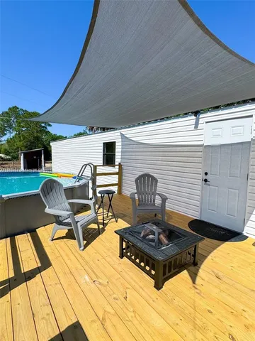 a view of a swimming pool with a patio