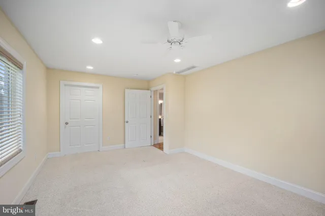 a view of balcony with wooden floor and seating space