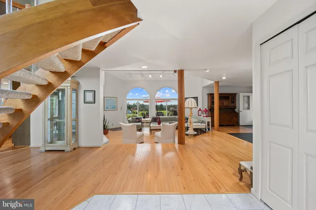 a view of a living room and entry way