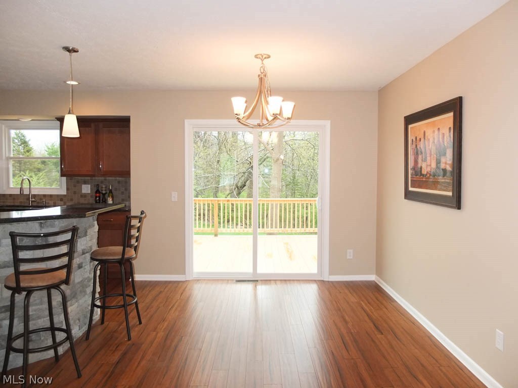1475 Sand Run Road Akron, OH 44313 - Photo 7 of 24 Dining room with slider to back deck.