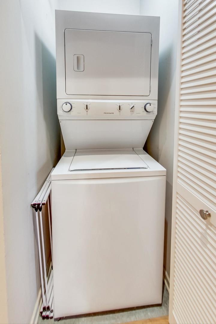 1040 West Adams Street, Unit 220 Chicago, IL 60607 - Photo 13 of 27 a utility room with dryer and washer