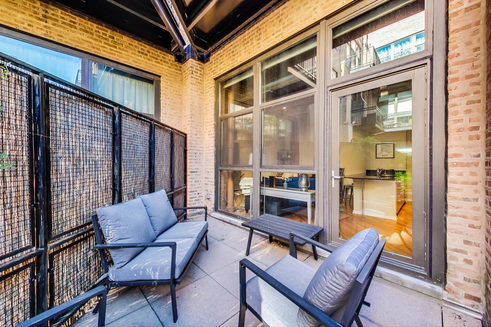 1040 West Adams Street, Unit 220 Chicago, IL 60607 - Photo 15 of 27 a outdoor living space with furniture