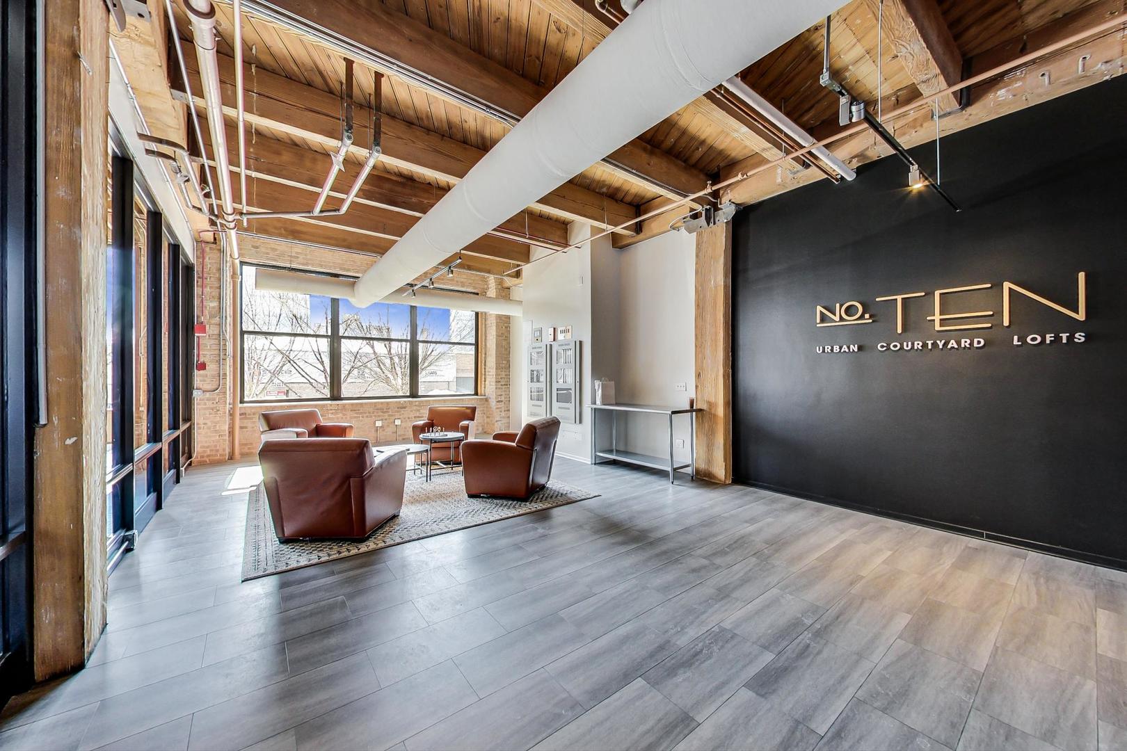 1040 West Adams Street, Unit 220 Chicago, IL 60607 - Photo 18 of 27 a view of livingroom with furniture and window