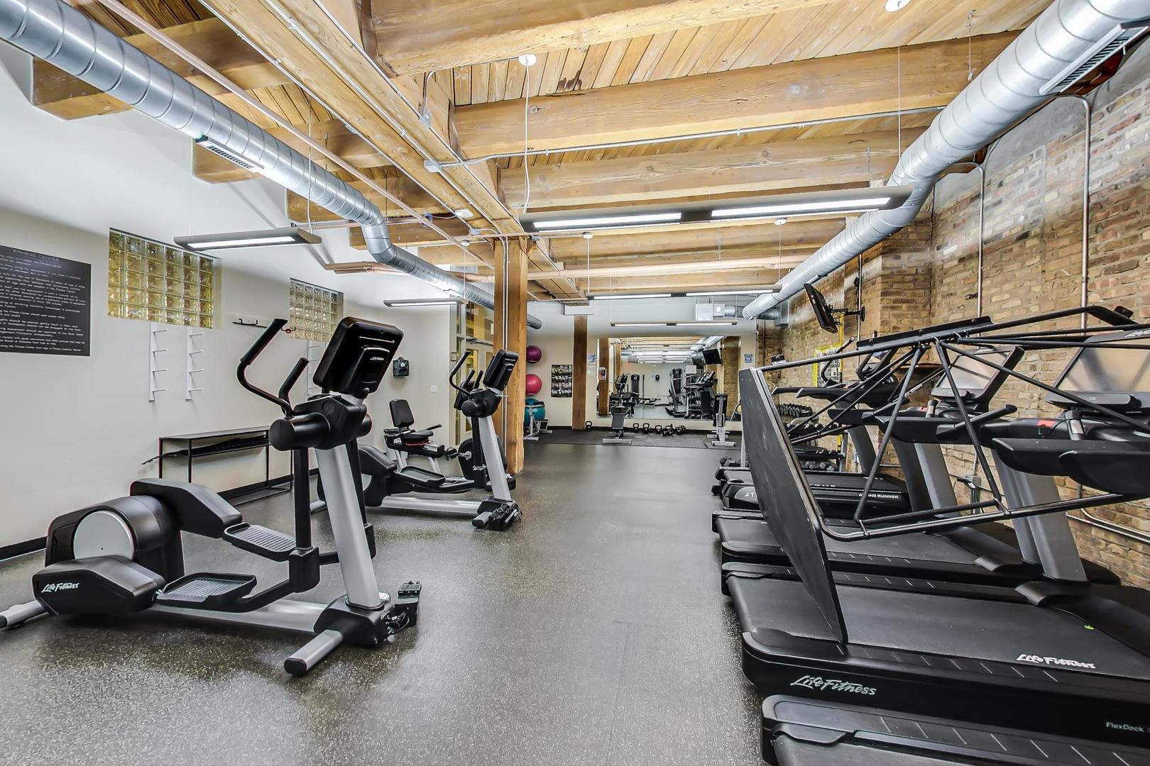 1040 West Adams Street, Unit 220 Chicago, IL 60607 - Photo 19 of 27 a view of a room with gym equipment