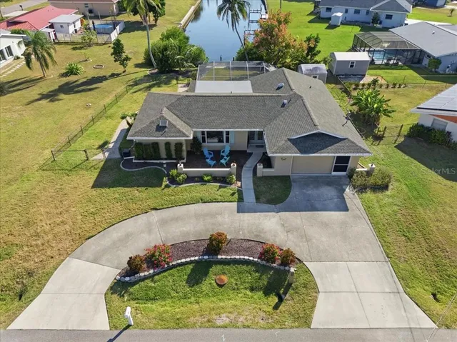 an aerial view of a house with swimming pool