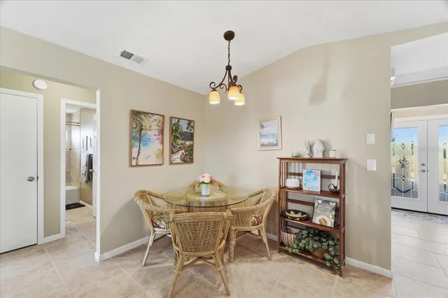 a dining room with furniture and window