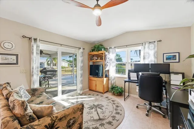 a bedroom with furniture and a window