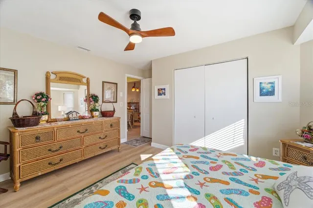 a bed room with a bed and a dresser in it