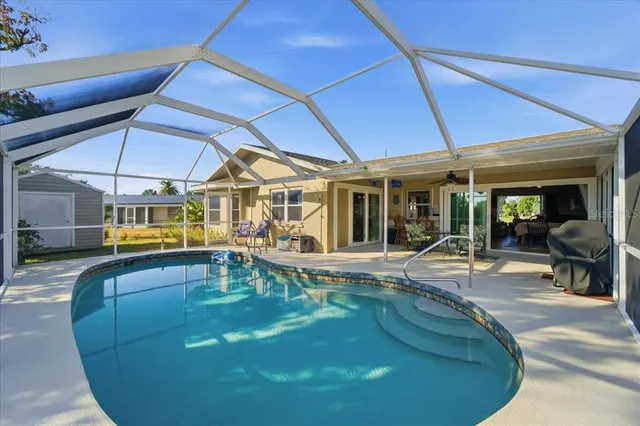 a view of a swimming pool with a patio