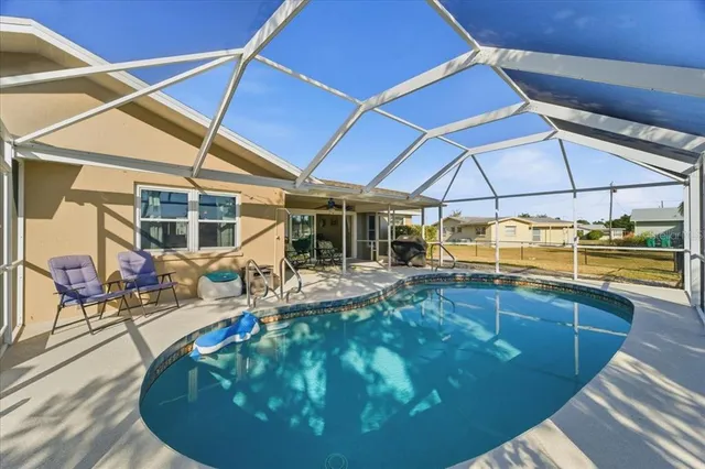 a view of a swimming pool with a patio